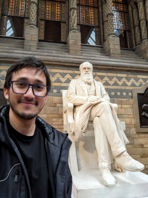 Doctor George G. Vega Yon with Charles Darwin's sculpture at the British Museum